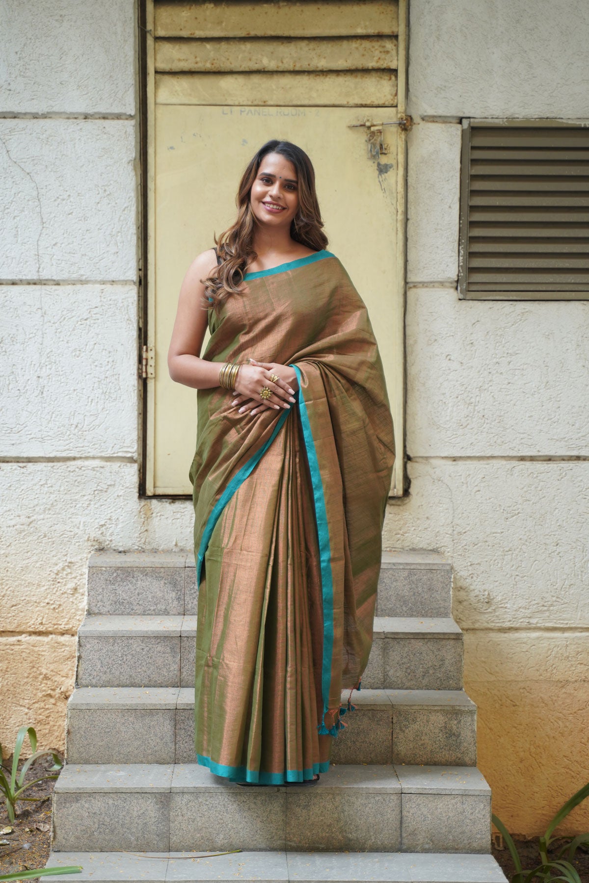 Metallic Copper Khadi Tissue with Dynasty Green Border Saree